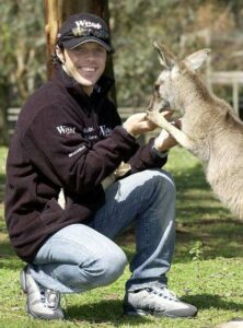 MTR24-Blog-Loris Capirossi of Italy feeds the Kangaroos at the Phillip Island Wildlife Park in the lead-up to the Australian Moto GP, 17 October 2002. Capirossi is sitting in 7th position in the Moto GP championship race behind compatriot Valentino Rossi. 